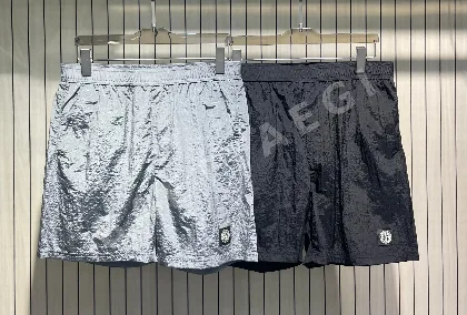 스톤아일랜드 경량 메탈릭 나일론 허리밴드 반바지 50890